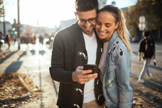 istock Couple looking at the smartphone 1129675421