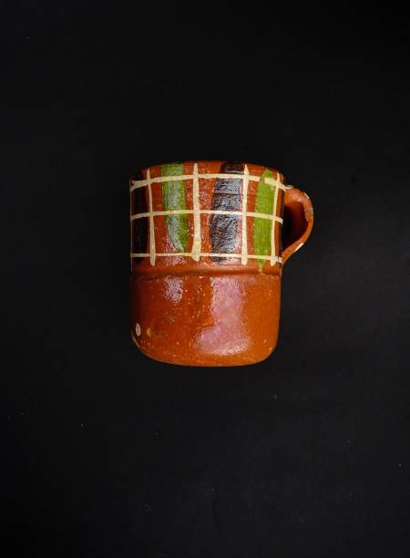 Artisanal Clay Cup, handcrafted earthware from Jalisco Mexico, Isolated on a black background
