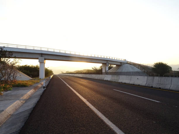 Small Bridge over the Highway at dawn Small Bridge over the Highway at dawn mexico state photos stock pictures, royalty-free photos & images