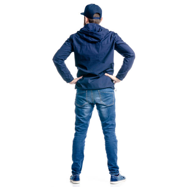 istock A man in jeans and jacket standing looking 1129675799