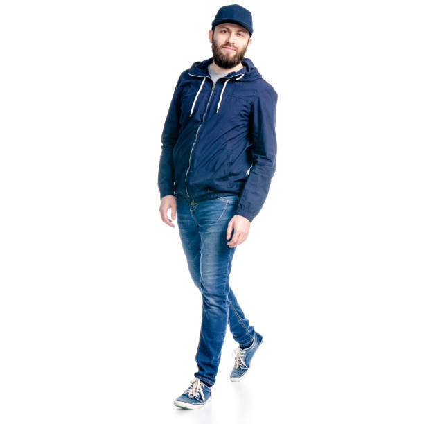 istock A man in jeans and jacket walking goes 1129675805