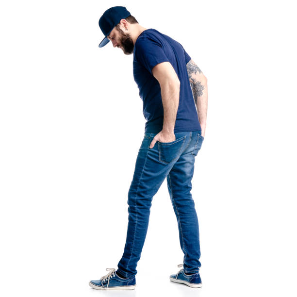 istock A man in jeans and cap looks goes walking 1129675860