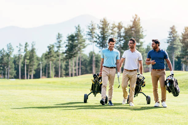 Team of golf players walking together