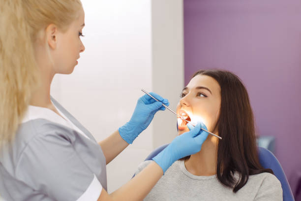 istock Dentist examining a patient's teeth in the dentist office 1129677417