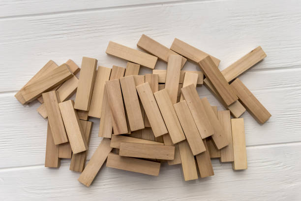 istock Wooden blocks for tower building on the desk 1129678386