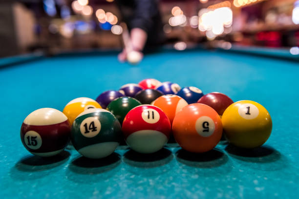 istock Set of billiard balls in triangle on table 1129679723