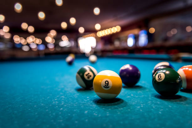 istock Colorful billiard balls on playing table, dispersed 1129679772