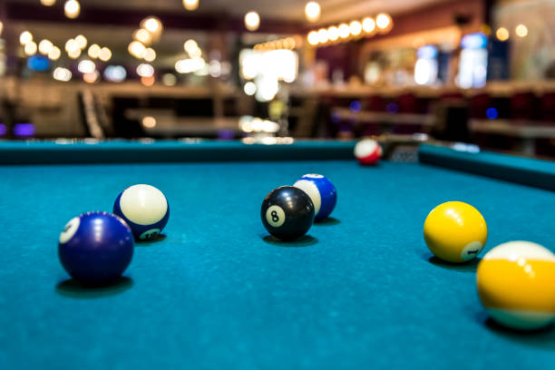 istock Colorful billiard balls on table, game and gambling 1129680501