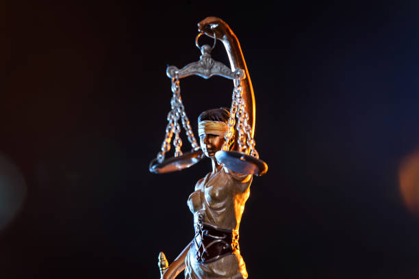 istock Statue goddess of justice on dark background 1129680796