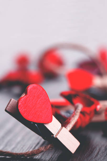 istock Red heart on black wooden background 1129682998