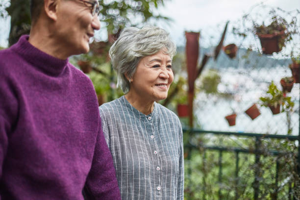 istock Smiling senior couple looking away at restaurant 1129687796
