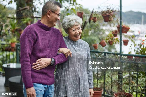 Happy Affectionate Senior Couple Walking Together Stock Photo - Download Image Now - Senior Adult, Couple - Relationship, Chinese Ethnicity