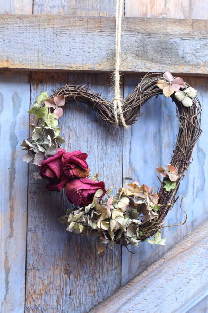 istock A heart shaped wreath  with dried roses 1129691852