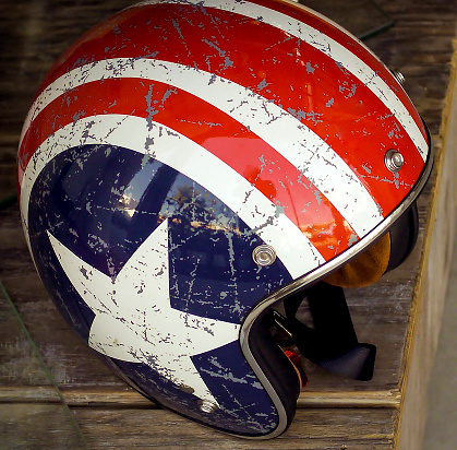 Vintage red white and blue motorcycle helmet with white star