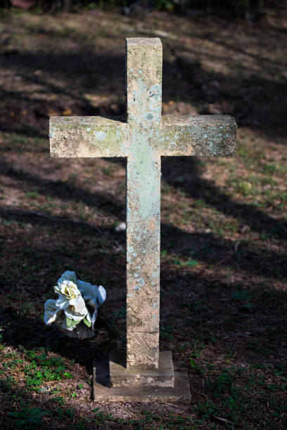 istock Cross and Flower at an old Cemetery 1129692221
