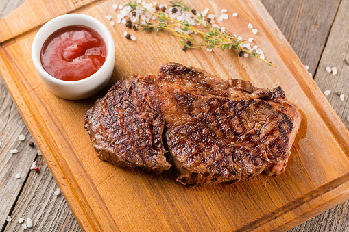 Chuck Roll. Grilled Beef steak on wooden board