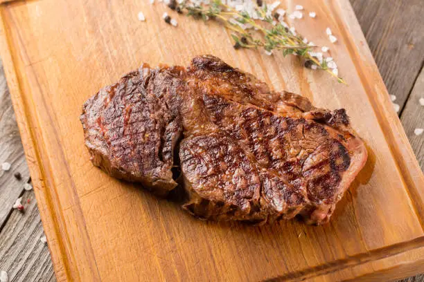 Chuck Roll. Grilled Beef steak on wooden board
