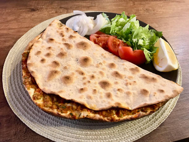 istock Lahmacun Turkish dishes / Turkish Pizzas, Lemon, Parsley 1129693906