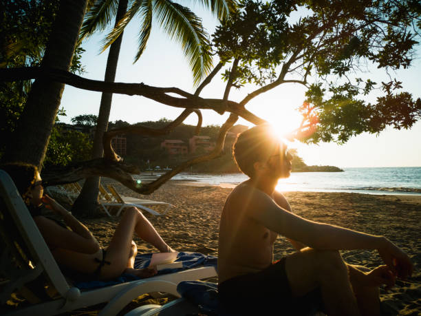 istock Contemplate the sunset on the beach 1129696774
