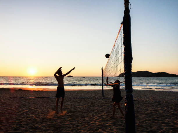 istock Playing volleyball on the beach 1129697409