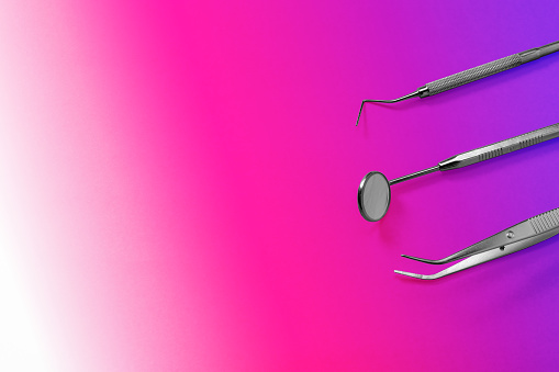Dentist Tools Mirror Dental Probe And Tweezers On Purple Gradient Background Stock Photo - Download Image Now - iStock Dentist Tools Mirror Dental Probe And Tweezers On Purple Gradient Background Stock Photo - Download Image Now - iStock