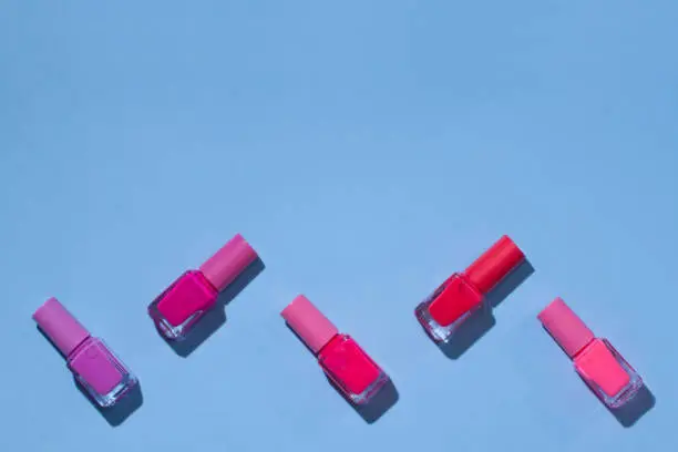 Photo of Isolated nail bottle on a white background.