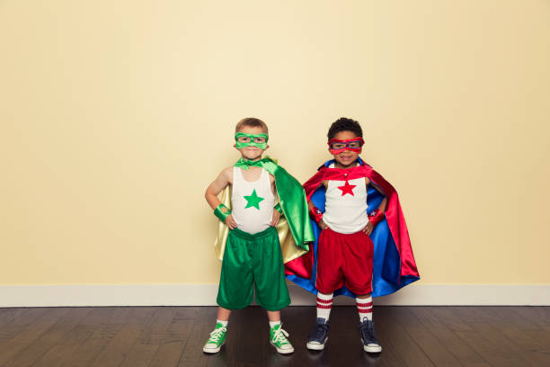 young boys dressed as superheroes - partnership creativity superhero child imagens e fotografias de stock