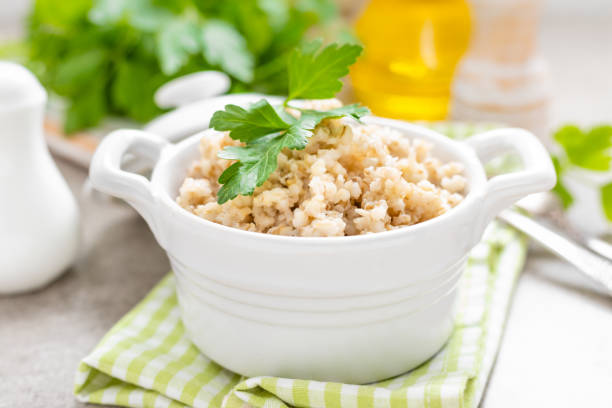 Barley porridge on white background