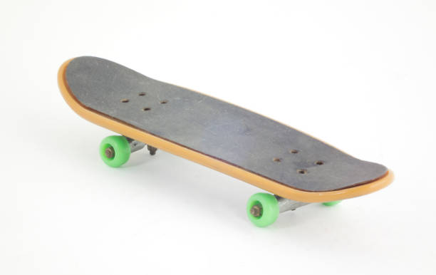 istock Close-Up Of Skateboard Over White Background 1129702436