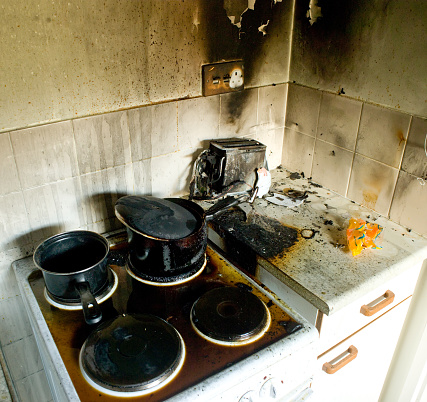 a recent fire in a domestic kitchen showing damage to various appliances