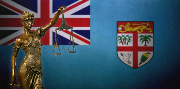istock Lady Justice before a Fijian flag 1129703431