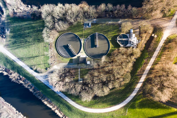 A water cleaning plant purifying sewage water in Waalwijk, Noord Brabant, Netherlands. Purifying water seen from a birds eye view. berkel stock pictures, royalty-free photos & images