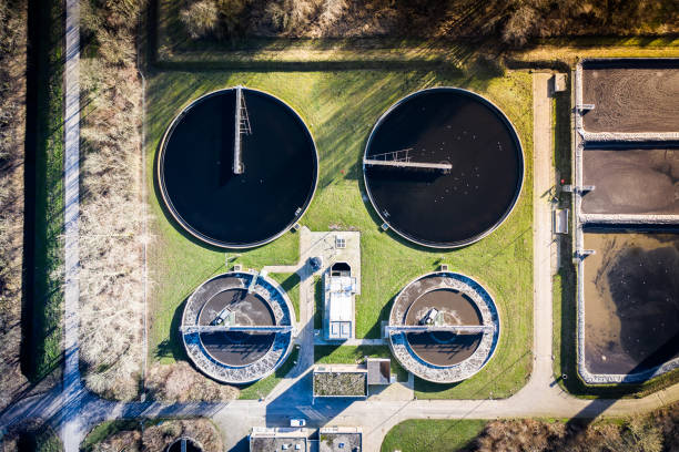 A water cleaning plant purifying sewage water in Waalwijk, Noord Brabant, Netherlands. Purifying water seen from a birds eye view. berkel stock pictures, royalty-free photos & images