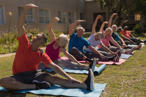 istock Group of senior people exercising in the park 1129705445