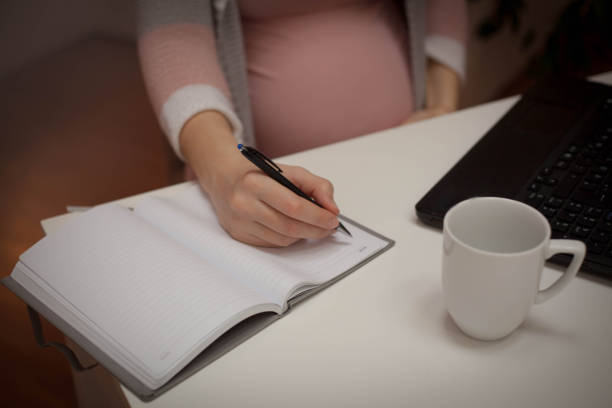 istock Working pregnant woman. 1129705451