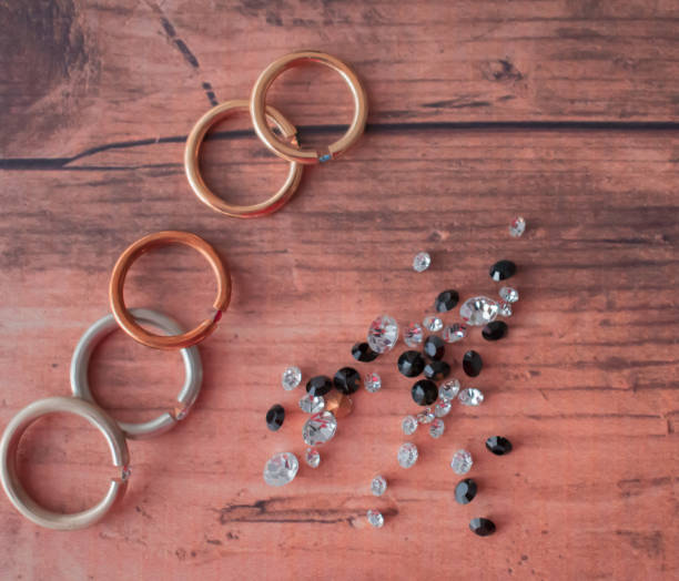 Beautiful rings made with precious stones (on the work bench).