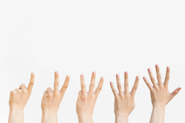 istock Male hands counting from one to five isolated on white background. 1129707165