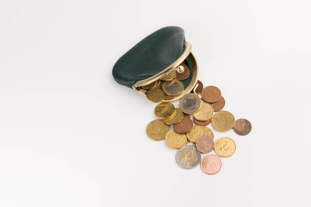 istock small leather wallet with coins  isolated on white background, top view 1129711743