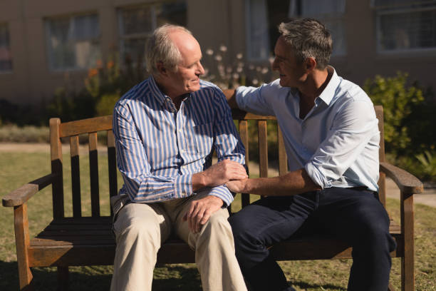 istock Senior men talking with each other in the park 1129713798