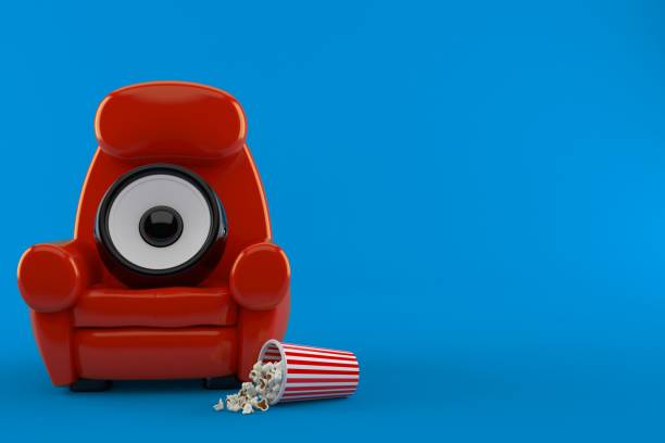 istock Audio speaker with theater armchair and popcorn 1129713882