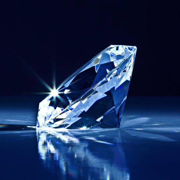 istock Close-Up Of Diamond Against Black Background 1129715924