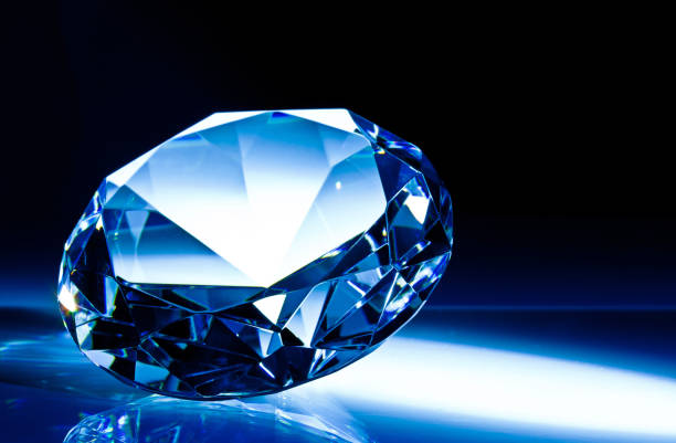istock Close-Up Of Diamond Against Black Background 1129716591