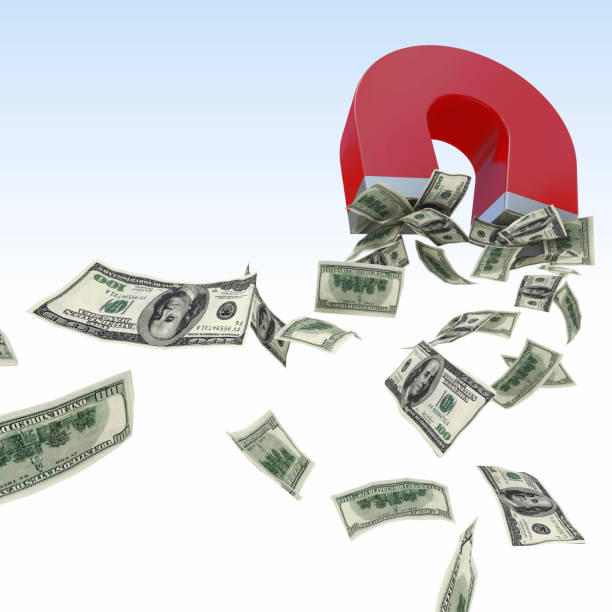istock Magnet Attracting Money Against White Background 1129717181