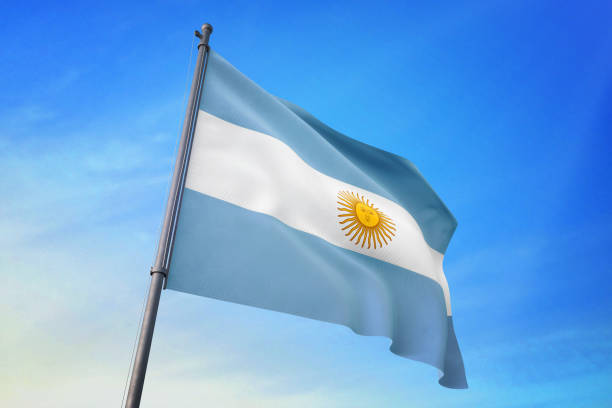 istock Argentina flag waving in the blue sky 1129717267