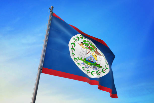 istock Belize flag waving in the blue sky 1129717350