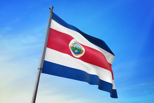 Costa Rica flag waving in the blue sky in the wind