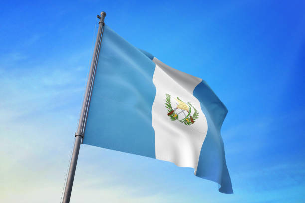 istock Guatemala flag waving in the blue sky 1129718376