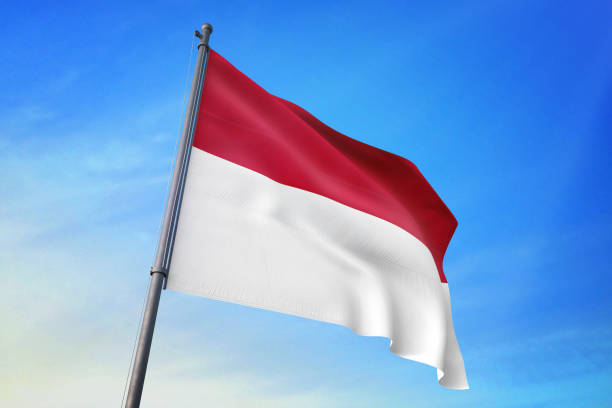 istock Indonesia flag waving in the blue sky 1129718479