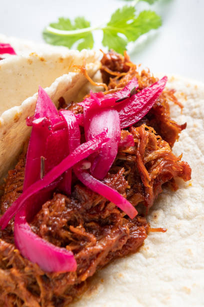 istock Tacos de Cochinita Pibil (puller pork Mexican style taco) 1129718504