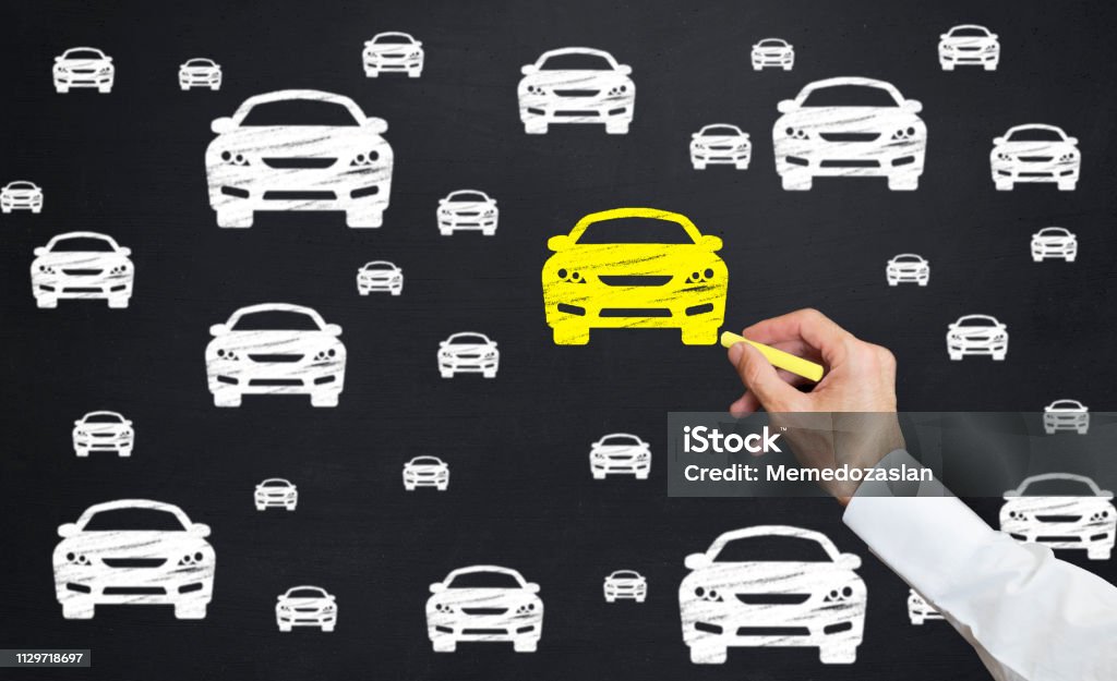 hand drawing car icon. Man point yellow car icon with chalk on blackboard Buying Stock Photo